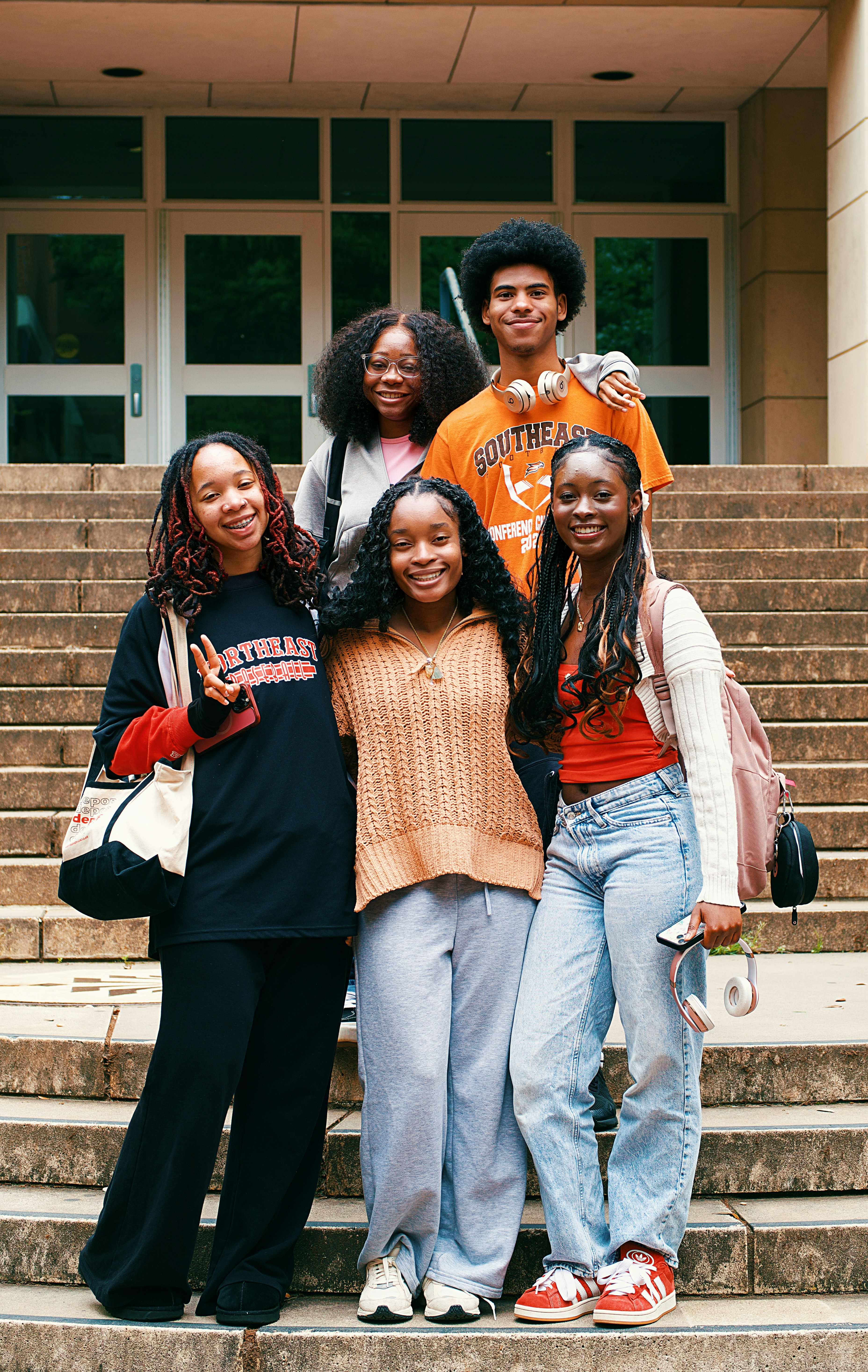 Students standing together in front of a building